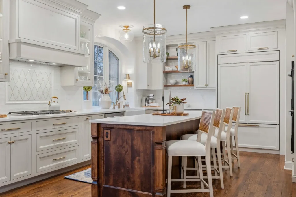 A well lit elegant kitchen addition design with custom cabinetry, high-end appliances, and luxurious finishes.
