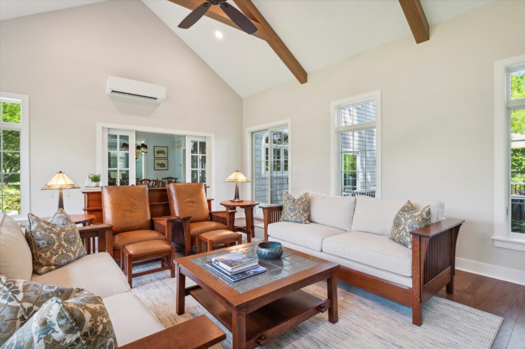 Luxury sitting room with tall ceiling perfectly lit natural lights.