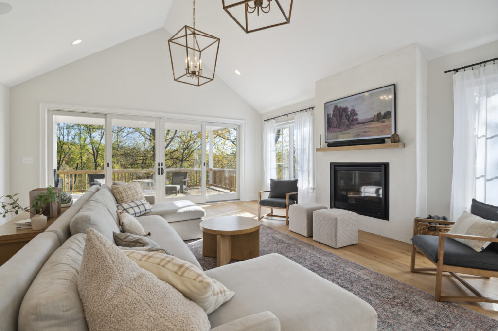 A living room with a vaulted custom ceiling